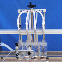 Machine de remplissage de liquides entièrement automatique à 4 têtes avec pompe magnétique pour parfums, boissons, jus, crèmes et eau en bouteille