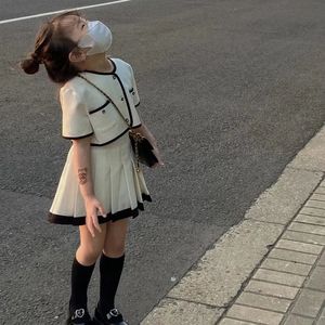 Nuova moda estiva 2 pezzi Set per ragazze in tinta unita a maniche corte Cardigan gonna per bambini vestiti - Product Image 5