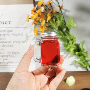 Offre Spéciale personnalisé mini bocal Mason en verre 50ml <span class=keywords><strong>petit</strong></span> bocal <span class=keywords><strong>à</strong></span> <span class=keywords><strong>confiture</strong></span> avec poignée en gros pour le stockage du chocolat bouchon <span class=keywords><strong>à</strong></span> vis étanchéité - Product Image 1