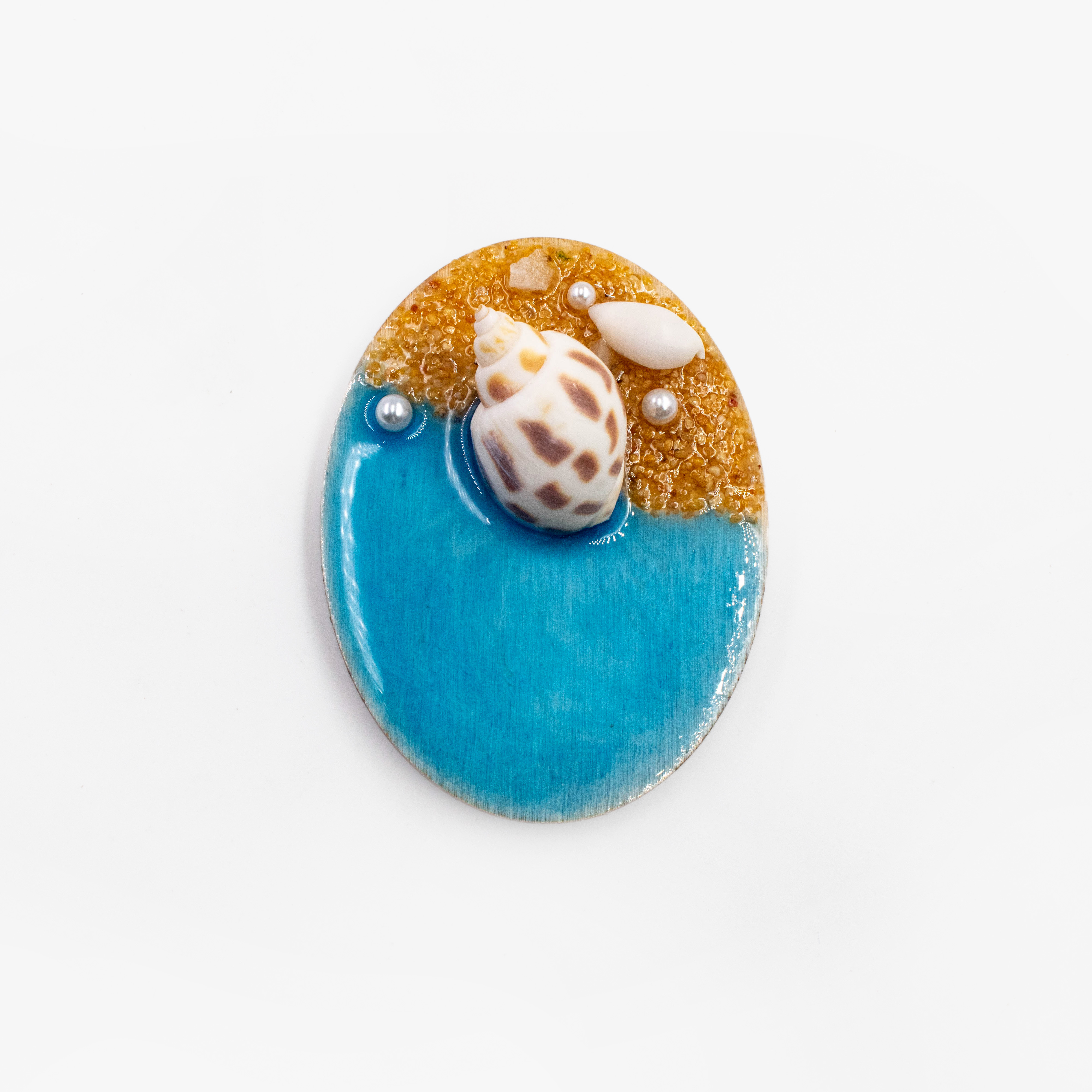 Coquille de sable à la dérive azur