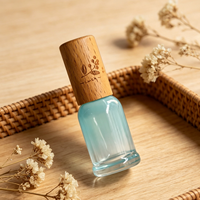 Bouteille d'emballage en verre aromatique bleu dégradé avec bouchon en bois de hêtre