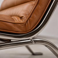 Fauteuil lounge mi-siècle en cuir vintage avec structure en acier inoxydable poli, fauteuil d'appoint pour salon