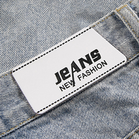 Étiquettes en cuir PU personnalisées avec logo en relief pour vêtements, jeans