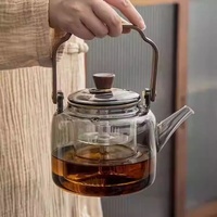Théière en verre borosilicate de haute qualité avec poignée en forme de barre, résistante à la chaleur, pour cuisinière, théière à fleurs, service à thé domestique