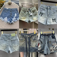 Shorts taille basse en jean style Wind Spicy Girl, avec un design féminin et des franges sexy, à porter en extérieur avec fesses apparentes