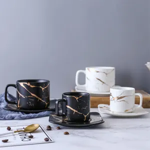 संगमरमर मैट गोल्ड सीरीज जापानी काले और सफेद कप और तश्तरी सेट कप