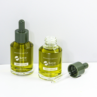 Botol Serum Minyak Rambut Kaca Warna Hijau Zaitun 60ml 2oz Desain Bahu Miring dengan Pipet, Kemasan Skrin, Dapat Dikustomisasi