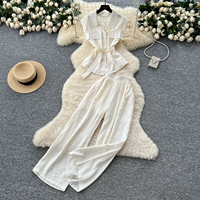 Ensemble pantalon taille haute et pantalon large élégant d'été pour femme, avec haut sans manches à revers boutonné et ceinture, idéal pour le bureau et les trajets quotidiens