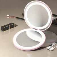 Logo personnalisé Mini miroir cosmétique de maquillage rond double face rechargeable par USB avec lumière LED Miroir de poche pliant portable