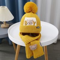 Ensemble bonnet et écharpe pour enfants, vente en gros d'usine, doublure polaire, bonnet tricoté épais avec cache-oreilles, protection thermique contre le froid hivernal