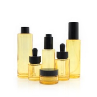 Flacon compte-gouttes en verre transparent à épaule plate orange de 20 à 100 ml avec bouchon noir pour huile essentielle, soin de la peau, pot