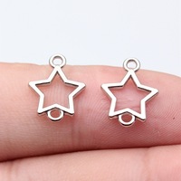 Conector de 2 bucles con contorno de estrella hueca, 15x12mm, de aleación de plata antigua, para cadena de collar en capas