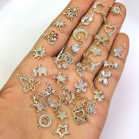 Usine en gros minuscules breloques pour la fabrication de bijoux or 14k petite étoile lune papillon coeur bijoux pendentif breloques