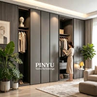 Armoire intégrée murale en bois composite gris foncé avec bureau intégré, étagères ouvertes et éclairage LED