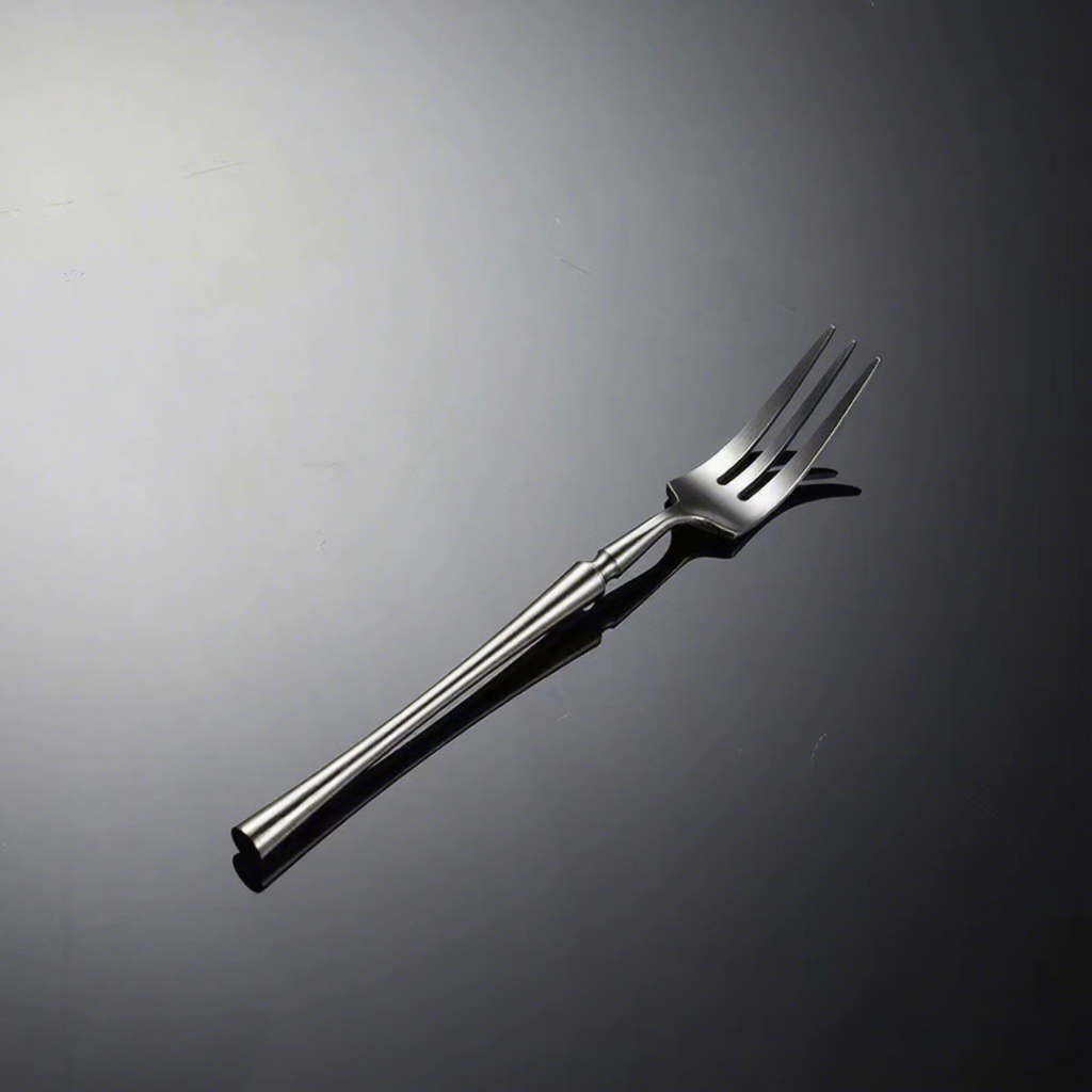 Tenedor de té de plata