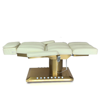 Table de massage électrique avec base chauffante dorée et éclairage LED pour soins du visage