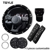 Ensemble d'accessoires de voiture populaires en cuir PU Xingyue, comprenant un couvre-volant à 3 branches scintillant, un couvre-levier de vitesse, un couvre-frein à main et un coussinet d'accoudoir.