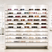 Comptoir îlot en verre noir pour magasin d'optique avec étagères lumineuses pour présentation de lunettes CE ETL