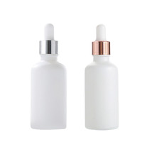 Vente en gros 5ml 10ml 15ml 20ml 30ml 50ml 100ml Essence liquide blanc laiteux Bouteilles de lotion d'huile d'essence et contenants en verre cosmétiques