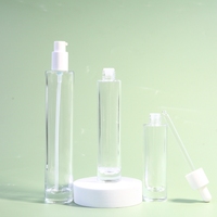 Bouteille de lotion en verre transparente de luxe de 30-100ml avec pompe sérum de lotion crème vide pour la sérigraphie utilisation différente d'emballage