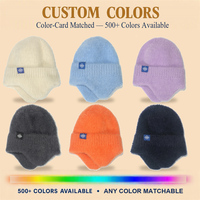 Bonnet en fausse fourrure de vison tricoté avec cache-oreilles, bord côtelé moelleux, patch flocon de neige, unisexe, pour l'hiver et l'extérieur, couleurs personnalisées, vente en gros
