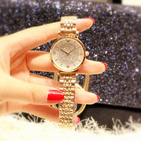 Montre-bracelet de luxe à quartz pour femme en acier inoxydable, design étoilé rose clair avec diamants, étanche, cadran à aiguilles