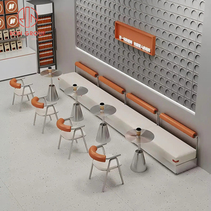 Set di Arredamento Commerciale per Ristoranti: Divano a L in Pelle Bianca per Caffetteria, Tavoli Rotondi in Metallo e Sedie Arancioni per Bar - Product Image 5