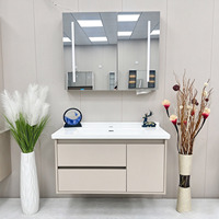 Ensemble de meubles de salle de bain modernes avec armoire en PVC, miroir intelligent, lavabo en céramique, montage mural pour hôtel et appartement