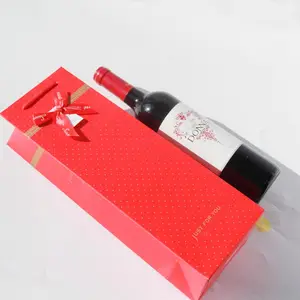 Custom white cardboard gift bag with handles, suitable for shopping, clothing, and presenting fancy red wine bottles.