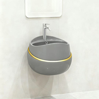 Ensemble de salle de bain en céramique de luxe noir et or en forme d'œuf, lavabo mural et toilettes GoodSell, lavabo sur pied