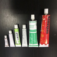 Machine de remplissage, de scellement et de sertissage de tubes en aluminium pliables pour peinture et pommade