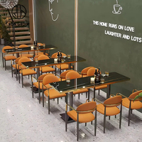 Ensemble de table et banquette de café commercial au design moderne, respectueux de l'environnement, en marbre, cuir et fer, pour restaurant