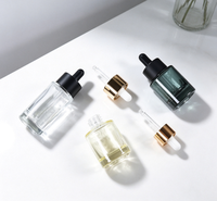 Botol Tetes Kaca Berbentuk Bulat 30ml 50ml Gradasi Kuning dengan Dasar Tebal untuk Serum Kosmetik dengan Tutup Emas.