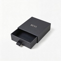 Boîte de rangement pour bijoux en carton noir écologique réutilisable avec fermeture magnétique, finition vernie imprimée en feuille d'or