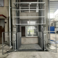 Monte-charge hydraulique vertical fixe pour charges lourdes, idéal pour l'entrepôt et le levage de marchandises