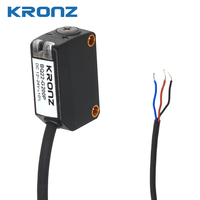 Sensor Fotoelektrik Kompak KRONZ dengan Supresi Latar Belakang (BGS), Jarak Deteksi 40-200mm, Indikator LED, Kompatibel dengan Balluff, IP67