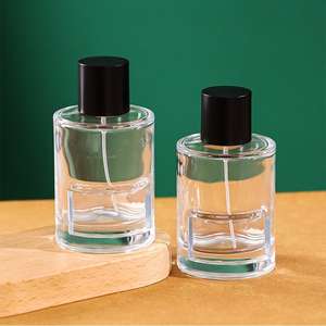 Flacon de <span class=keywords><strong>parfum</strong></span> en verre transparent de 100 ml, design cylindrique, avec bouchon noir, prix fabricant bas - Product Image 1
