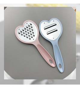 Precio al por mayor: cepilladora resistente de gama alta de acero inoxidable de 4 vías en forma de corazón, mango de PP de diseño clásico y de moda - Product Image 2