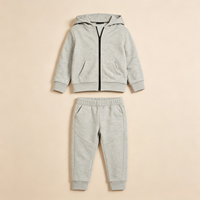Ensemble personnalisé pour garçons en coton extensible uni avec veste à capuche zippée intégrale et poche kangourou et pantalon de survêtement fuselé ODM pour l'automne et le quotidien