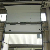 Porte sectionnelle industrielle moderne antivol robuste en contreplaqué avec surface ignifugée pour entrepôt et atelier