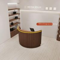 Bureau de réception incurvé cannelé de luxe et durable avec comptoir de réception LED demi-cercle, design personnalisable
