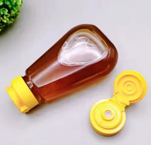 Bottiglia vuota di compressione del contenitore del miele di vendita calda per l'imballaggio della salsa con i coperchi su misura senza BPA