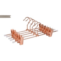 Cintre en métal plaqué cuivre pour pantalons et jupes, avec pince coulissante réglable et embouts en caoutchouc, pour rangement en boutique et placard