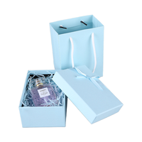 Boîtes coulissantes en carton blanc sur mesure fournies par l'usine avec rubans, adaptées aux parfums et aux cosmétiques.