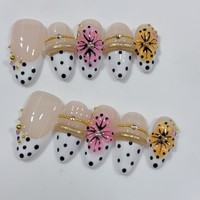 10 faux ongles amande à paillettes, style French, faits à la main, à presser, avec fleurs et perles dorées, couvrance totale avec pointe.