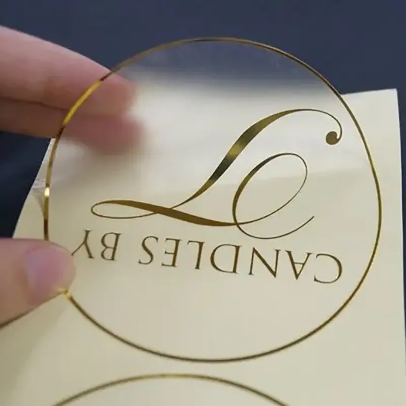 Hiçbir MOQ kendinden yapışkanlı özelleştirilmiş baskı açık altın folyo çıkartmaları şeffaf etiket Logo ile