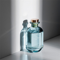 Bouteille en verre vide de luxe personnalisée de 100 ml avec surface sérigraphiée et ouverture facile pour diffuseur d'huiles essentielles