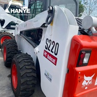 Chargeuse compacte Bobcat S220 d'occasion, capacité nominale 1035 kg, avec attaches rapides Bob-Tach pour la construction, l'agriculture et l'aménagement paysager