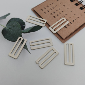 Venta al por mayor de anillas de sujetador de metal recubiertas de nailon con 9 ganchos, accesorios de lencería de aleación ecológica, conectores de tiras con patrones para ropa interior - Product Image 1