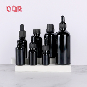 Bouteille en verre en gros pour huile 30ml 50ml Bouteille en verre ronde noire vide pour huile essentielle cosmétique Huile corporelle avec bouchons à vis compte-gouttes - Product Image 1